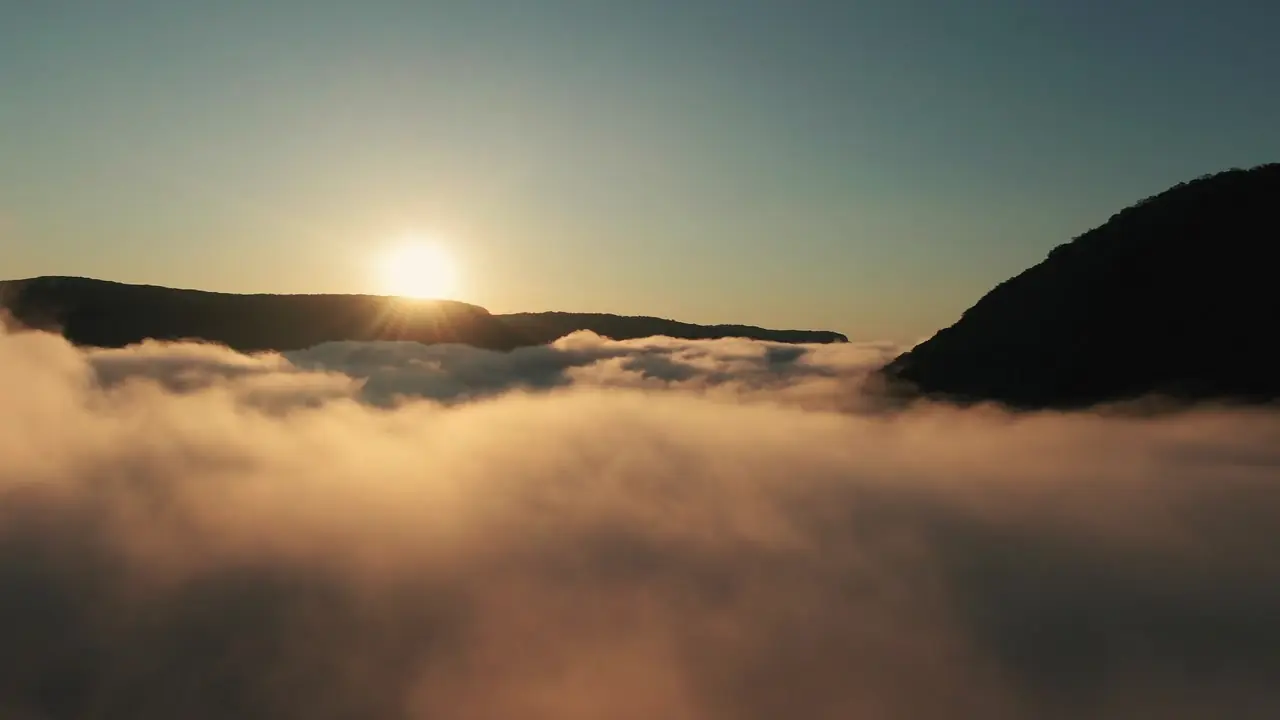 Example frame: a sea of cloud with the sun low on the horizon, seen from above