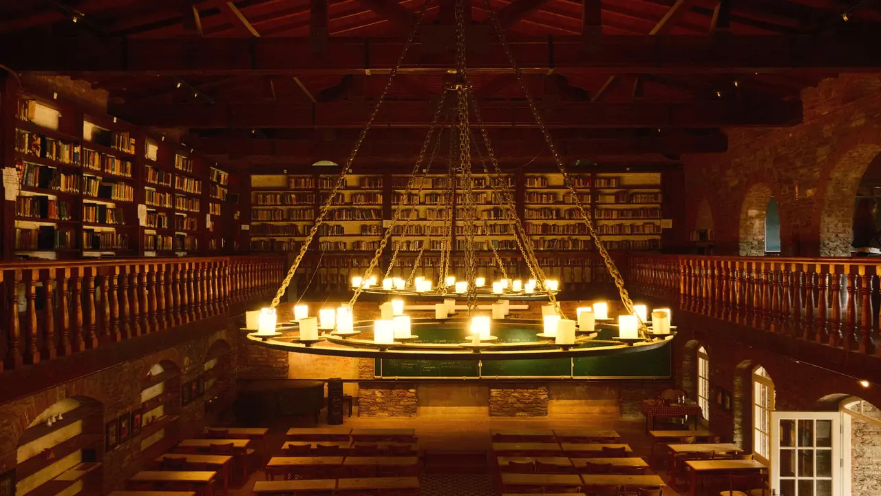 Example frame: a library with a lit chandelier