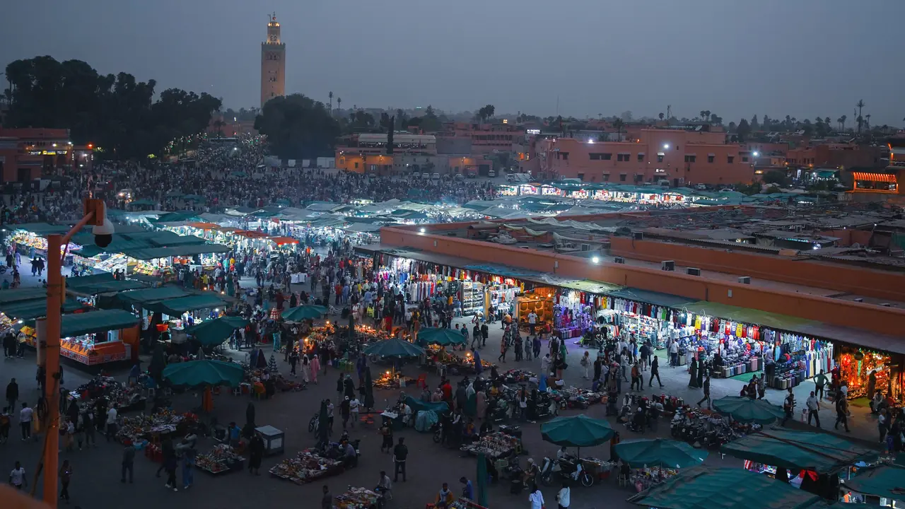 Example frame: an evening market in Marrakech seen from above
