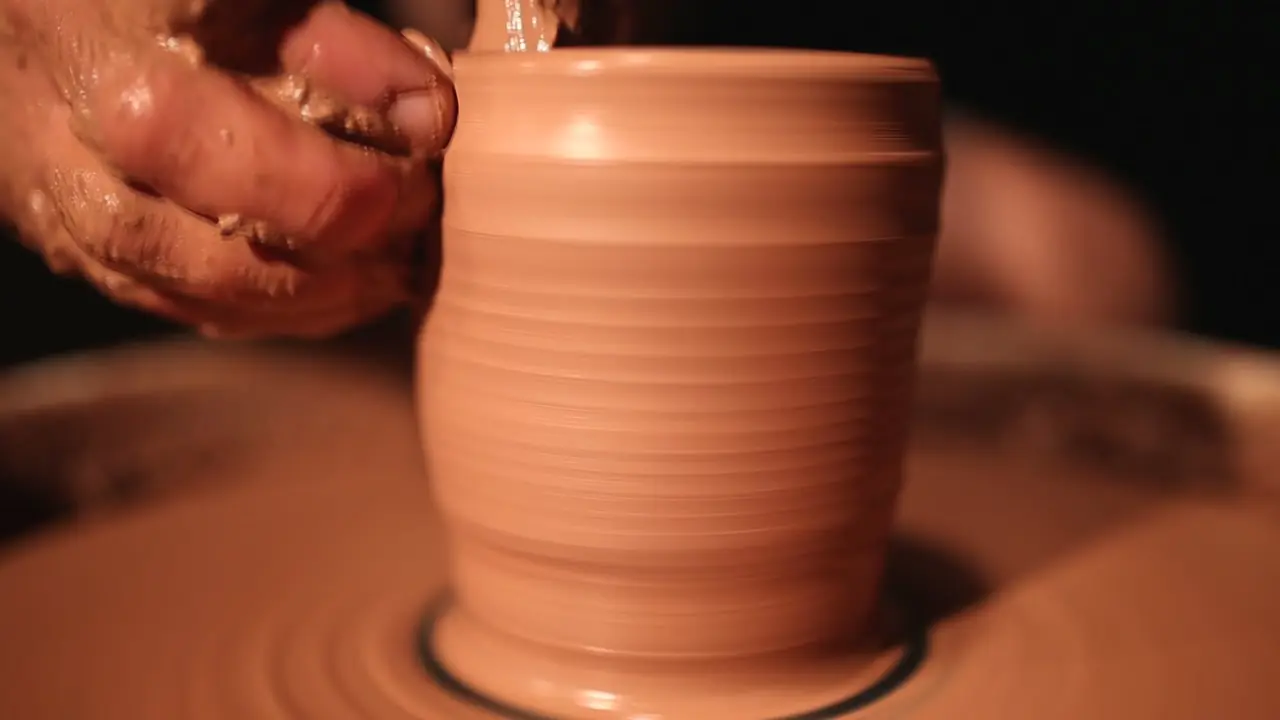 Example frame: hands shaping clay on a pottery wheel
